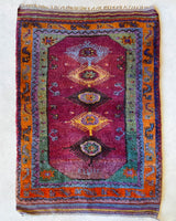 Vintage Turkish rug in a living room setting, pile rug, Turkish rug, vintage rug, portland, rug shop, bright colors, wild shaman, soft rug, bold color, Portland, Oregon, rug store, rug shop, local shop, antique rug