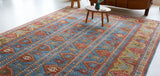 Vintage Turkish rug in a living room setting, pile rug, Turkish rug, vintage rug, portland, rug shop, bright colors, wild shaman, soft rug, bold color, Portland, Oregon, rug store, rug shop, local shop, antique rug,