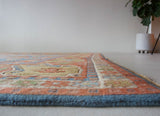 Vintage Turkish rug in a living room setting, pile rug, Turkish rug, vintage rug, portland, rug shop, bright colors, wild shaman, soft rug, bold color, Portland, Oregon, rug store, rug shop, local shop, antique rug,