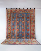 Vintage Turkish rug in a living room setting, pile rug, Turkish rug, vintage rug, portland, rug shop, bright colors, wild shaman, soft rug, bold color, Portland, Oregon, rug store, rug shop, local shop, antique rug,