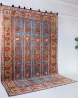 Vintage Turkish rug in a living room setting, pile rug, Turkish rug, vintage rug, portland, rug shop, bright colors, wild shaman, soft rug, bold color, Portland, Oregon, rug store, rug shop, local shop, antique rug,