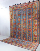 Vintage Turkish rug in a living room setting, pile rug, Turkish rug, vintage rug, portland, rug shop, bright colors, wild shaman, soft rug, bold color, Portland, Oregon, rug store, rug shop, local shop, antique rug,