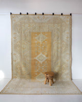 Area rug in a living room setting, pile rug, Turkish rug, old rug, antique rug, pastel colors, faded colors, Turkish rug, vintage rug, soft rug, Portland, Oregon, rug store, rug shop, local shop, warm colors