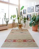 Vintage kilim rug in living room setting, old rug, antique rug, pastel colors, faded colors, Turkish rug, vintage rug, soft rug, Portland, Oregon, rug store, rug shop, local shop, earthy tones, earthy colors, warm colors, flat weave