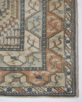 Area rug in a living room setting, pile rug, Turkish rug, old rug, antique rug, pastel colors, faded colors, Turkish rug, vintage rug, soft rug, Portland, Oregon, rug store, rug shop, local shop, pastel colors, warm colors