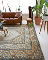 Area rug in a living room setting, pile rug, Turkish rug, old rug, antique rug, pastel colors, faded colors, Turkish rug, vintage rug, soft rug, Portland, Oregon, rug store, rug shop, local shop, pastel colors, warm colors