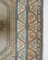 Area rug in a living room setting, pile rug, Turkish rug, old rug, antique rug, pastel colors, faded colors, Turkish rug, vintage rug, soft rug, Portland, Oregon, rug store, rug shop, local shop, pastel colors, warm colors