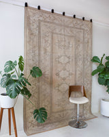 Vintage Turkish rug in living room setting, old rug, antique rug, pastel colors, faded colors, Turkish rug, vintage rug, soft rug, Portland, Oregon, rug store, rug shop, local shop