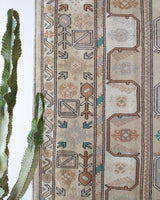 Area rug in a living room setting, pile rug, Turkish rug, old rug, antique rug, pastel colors, faded colors, Turkish rug, vintage rug, soft rug, Portland, Oregon, rug store, rug shop, local shop, pastel colors, warm colors