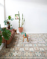 Area rug in a living room setting, pile rug, Turkish rug, old rug, antique rug, pastel colors, faded colors, Turkish rug, vintage rug, soft rug, Portland, Oregon, rug store, rug shop, local shop, pastel colors, warm colors