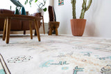 Area rug in a living room setting, pile rug, Turkish rug, old rug, antique rug, pastel colors, faded colors, Turkish rug, vintage rug, soft rug, Portland, Oregon, rug store, rug shop, local shop, pastel colors, warm colors