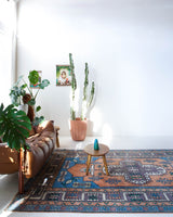 Vintage Turkish rug in living room setting, old rug, antique rug, pastel colors, faded colors, Turkish rug, vintage rug, soft rug, Portland, Oregon, rug store, rug shop, local shop, pastel colors