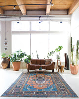 Vintage Turkish rug in living room setting, old rug, antique rug, pastel colors, faded colors, Turkish rug, vintage rug, soft rug, Portland, Oregon, rug store, rug shop, local shop, pastel colors