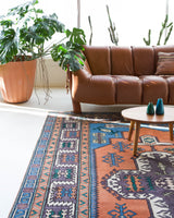 Vintage Turkish rug in living room setting, old rug, antique rug, pastel colors, faded colors, Turkish rug, vintage rug, soft rug, Portland, Oregon, rug store, rug shop, local shop, pastel colors
