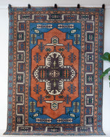 Vintage Turkish rug in living room setting, old rug, antique rug, pastel colors, faded colors, Turkish rug, vintage rug, soft rug, Portland, Oregon, rug store, rug shop, local shop, pastel colors