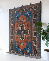 Vintage Turkish rug in living room setting, old rug, antique rug, pastel colors, faded colors, Turkish rug, vintage rug, soft rug, Portland, Oregon, rug store, rug shop, local shop, pastel colors