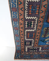 Vintage Turkish rug in living room setting, old rug, antique rug, pastel colors, faded colors, Turkish rug, vintage rug, soft rug, Portland, Oregon, rug store, rug shop, local shop, pastel colors