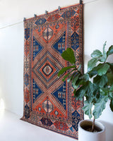 Vintage Turkish rug in living room setting, old rug, antique rug, pastel colors, faded colors, Turkish rug, vintage rug, soft rug, Portland, Oregon, rug store, rug shop, local shop, pastel colors