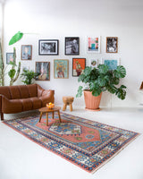 Vintage Turkish rug in a living room setting, pile rug, Turkish rug, vintage rug, portland, rug shop, bright colors, wild shaman, soft rug, bold color, Portland, Oregon, rug store, rug shop, local shop, antique rug