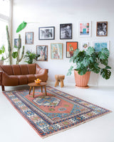 Vintage Turkish rug in a living room setting, pile rug, Turkish rug, vintage rug, portland, rug shop, bright colors, wild shaman, soft rug, bold color, Portland, Oregon, rug store, rug shop, local shop, antique rug