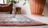 Vintage Turkish rug in a living room setting, pile rug, Turkish rug, vintage rug, portland, rug shop, bright colors, wild shaman, soft rug, bold color, Portland, Oregon, rug store, rug shop, local shop, antique rug