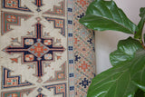 Vintage Turkish runner rug in living room setting, old rug, antique rug, pastel colors, faded colors, Turkish rug, vintage rug, soft rug, Portland, Oregon, rug store, rug shop, local shop