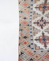 Vintage Turkish runner rug in living room setting, old rug, antique rug, pastel colors, faded colors, Turkish rug, vintage rug, soft rug, Portland, Oregon, rug store, rug shop, local shop