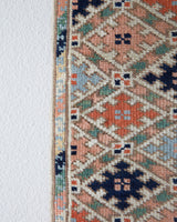 Vintage Turkish runner rug in living room setting, old rug, antique rug, pastel colors, faded colors, Turkish rug, vintage rug, soft rug, Portland, Oregon, rug store, rug shop, local shop