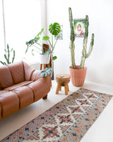 Vintage Turkish runner rug in living room setting, old rug, antique rug, pastel colors, faded colors, Turkish rug, vintage rug, soft rug, Portland, Oregon, rug store, rug shop, local shop
