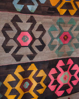 Vintage kilim rug in room decor setting, old rug, antique rug, pastel colors, faded colors, Turkish rug, vintage rug, soft rug, Portland, Oregon, rug store, rug shop, local shop, bold colors, bright colors, faded colors