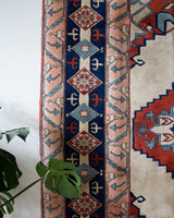 Vintage Turkish rug in a living room setting, pile rug, Turkish rug, vintage rug, portland, rug shop, bright colors, wild shaman, soft rug, bold color, Portland, Oregon, rug store, rug shop, local shop, antique rug