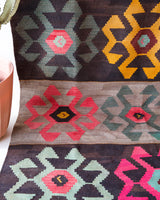Vintage kilim rug in room decor setting, old rug, antique rug, pastel colors, faded colors, Turkish rug, vintage rug, soft rug, Portland, Oregon, rug store, rug shop, local shop, bold colors, bright colors, faded colors