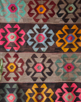Vintage kilim rug in room decor setting, old rug, antique rug, pastel colors, faded colors, Turkish rug, vintage rug, soft rug, Portland, Oregon, rug store, rug shop, local shop, bold colors, bright colors, faded colors