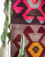 Vintage kilim rug in room decor setting, old rug, antique rug, pastel colors, faded colors, Turkish rug, vintage rug, soft rug, Portland, Oregon, rug store, rug shop, local shop, bold colors, bright colors, faded colors