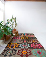Vintage kilim rug in living room setting, bright colors, wild shaman, soft rug, bold color, Portland, Oregon, rug store, rug shop, local shop, vintage rug, modern kilim, warm colors