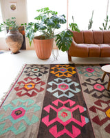 Vintage kilim rug in living room setting, bright colors, wild shaman, soft rug, bold color, Portland, Oregon, rug store, rug shop, local shop, vintage rug, modern kilim, warm colors