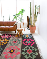 Vintage kilim rug in living room setting, bright colors, wild shaman, soft rug, bold color, Portland, Oregon, rug store, rug shop, local shop, vintage rug, modern kilim, warm colors