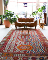 Vintage kilim rug in room decor setting, old rug, antique rug, pastel colors, faded colors, Turkish rug, vintage rug, soft rug, Portland, Oregon, rug store, rug shop, local shop, bold colors, bright colors, faded colors, antique kilim