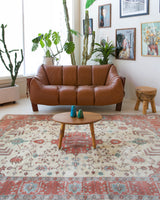 Vintage Turkish rug in living room setting, old rug, antique rug, pastel colors, faded colors, Turkish rug, vintage rug, soft rug, Portland, Oregon, rug store, rug shop, local shop