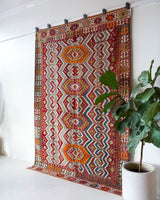Vintage kilim rug in room decor setting, old rug, antique rug, pastel colors, faded colors, Turkish rug, vintage rug, soft rug, Portland, Oregon, rug store, rug shop, local shop, bold colors, bright colors, faded colors, antique kilim