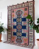 Vintage Turkish rug in a living room setting, pile rug, Turkish rug, vintage rug, portland, rug shop, bright colors, wild shaman, soft rug, bold color, Portland, Oregon, rug store, rug shop, local shop