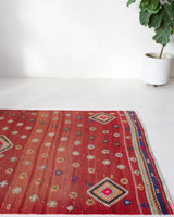 Vintage kilim rug in room decor setting, old rug, antique rug, pastel colors, faded colors, Turkish rug, vintage rug, soft rug, Portland, Oregon, rug store, rug shop, local shop, bold colors, bright colors, faded colors