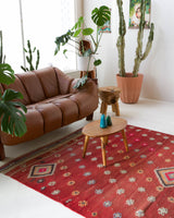 Vintage kilim rug in room decor setting, old rug, antique rug, pastel colors, faded colors, Turkish rug, vintage rug, soft rug, Portland, Oregon, rug store, rug shop, local shop, bold colors, bright colors, faded colors