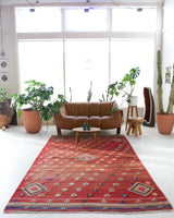 Vintage kilim rug in room decor setting, old rug, antique rug, pastel colors, faded colors, Turkish rug, vintage rug, soft rug, Portland, Oregon, rug store, rug shop, local shop, bold colors, bright colors, faded colors