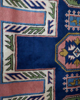 Vintage Turkish rug in a living room setting, pile rug, Turkish rug, vintage rug, portland, rug shop, bright colors, wild shaman, soft rug, bold color, Portland, Oregon, rug store, rug shop, local shop