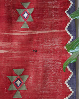 Vintage kilim rug in room decor setting, old rug, antique rug, pastel colors, faded colors, Turkish rug, vintage rug, soft rug, Portland, Oregon, rug store, rug shop, local shop, bold colors, bright colors, faded colors