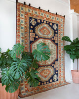 Vintage Turkish rug in a living room setting, pile rug, Turkish rug, vintage rug, portland, rug shop, bright colors, wild shaman, soft rug, bold color, Portland, Oregon, rug store, rug shop, local shop