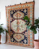 Vintage Turkish rug in a living room setting, pile rug, Turkish rug, vintage rug, portland, rug shop, bright colors, wild shaman, soft rug, bold color, Portland, Oregon, rug store, rug shop, local shop