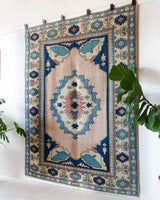 Vintage Turkish rug in living room setting, old rug, antique rug, pastel colors, faded colors, Turkish rug, vintage rug, soft rug, Portland, Oregon, rug store, rug shop, local shop