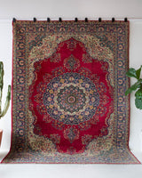 Vintage Turkish rug in a living room setting, pile rug, Turkish rug, vintage rug, portland, rug shop, bright colors, wild shaman, soft rug, bold color, Portland, Oregon, rug store, rug shop, local shop, antique rug,  carpet, ottoman design, floral carpet, traditional carpet, oriental rug